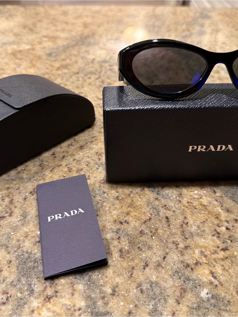 Prada Black Cat-Eye Sunglasses with Dark Lenses